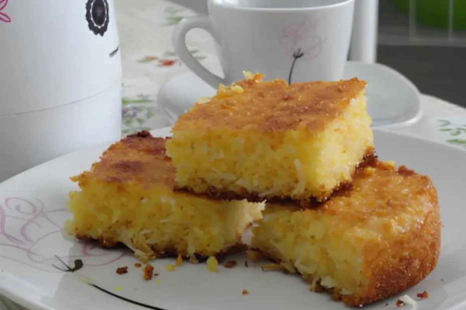 uma mesa preparada para café da manhã com um bolo de flocão de milho com coco.