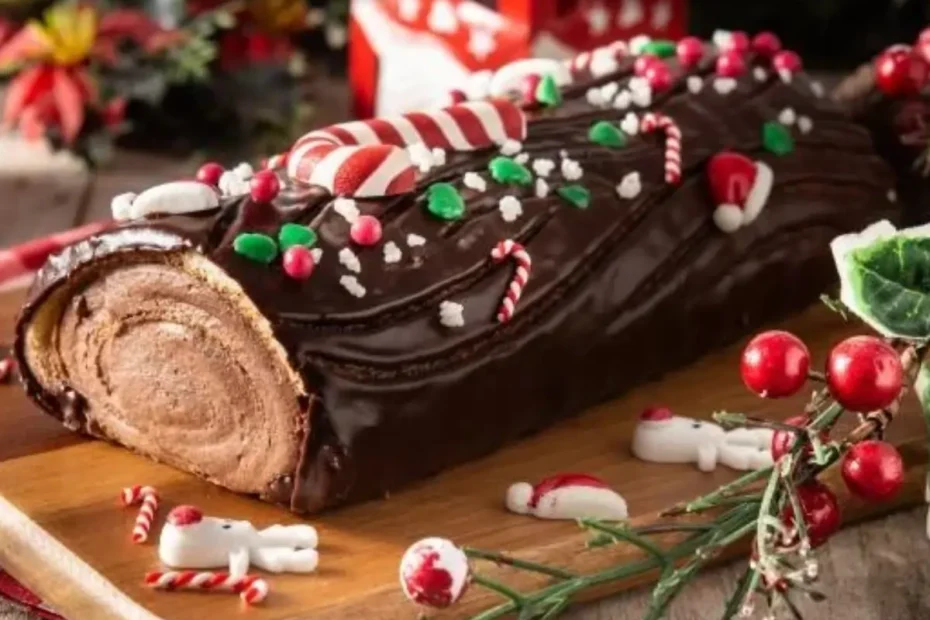 Um buche noel em cima de uma mesa decorada para o natal.